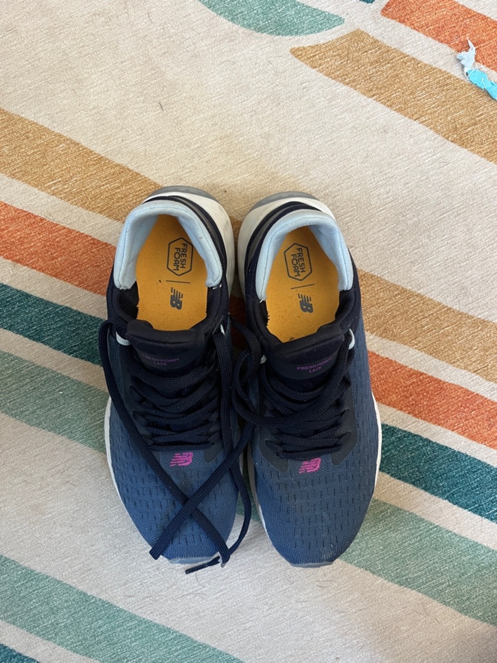 New Balance Navy Athletic Sneakers with Pink Logo and Yellow Insoles